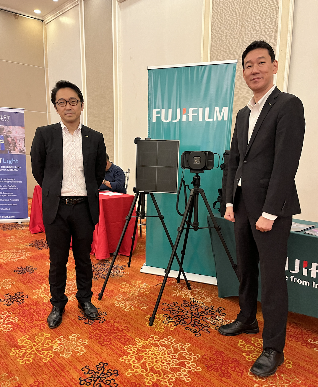 FUJIFILM representatives, Takashi Miyako, Vice President & General Manager for Medical systems Division, and Masahiro Uehara, President, are pictured alongside the FDR Xair - a cutting-edge portable X-ray system