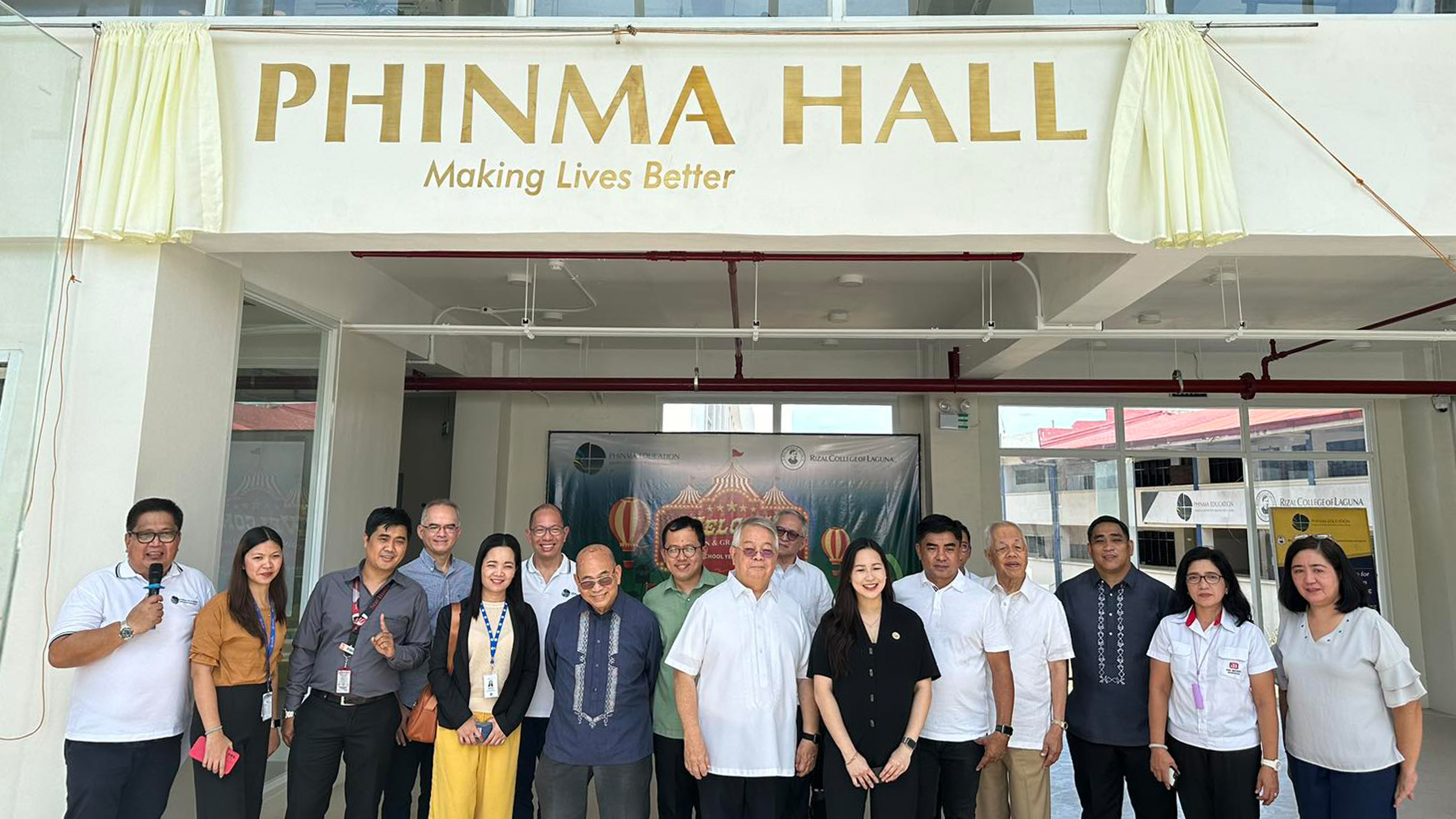 PHINMA and PHINMA Education executives, faculty, and board members in front of PHINMA Hall