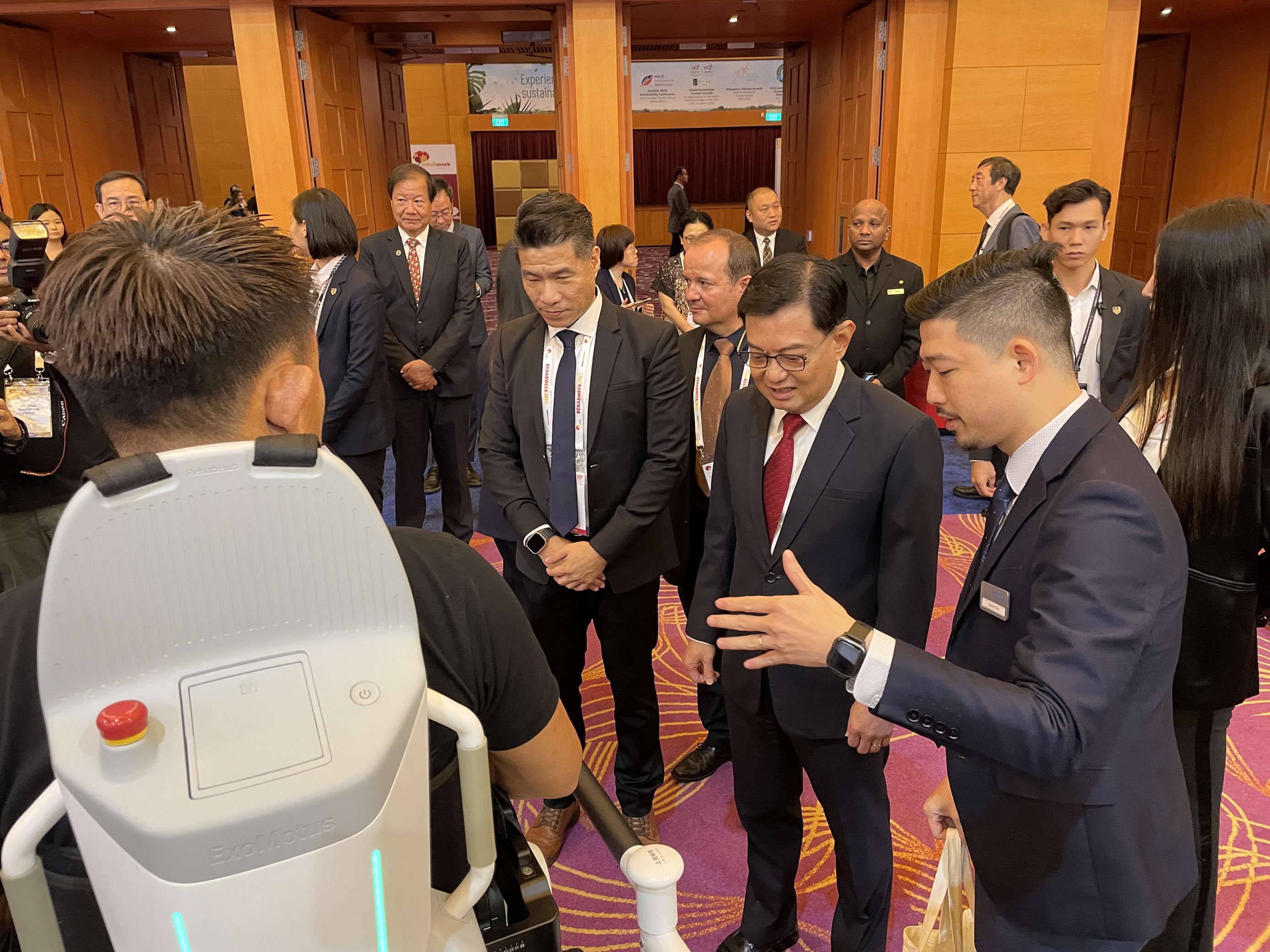 <b>Picture 1:</b> From Left to Right – Zen Koh, Co-Founder & Global CEO of Fourier Intelligence, Mr Heng Swee Keat, Deputy Prime Minister of Singapore and Coordinating Minister for Economic Policies and Owen Teoh, COO & Managing Director of Fourier Intelligence with the ExoMotus™ M4 at RehabWeek 2023.  