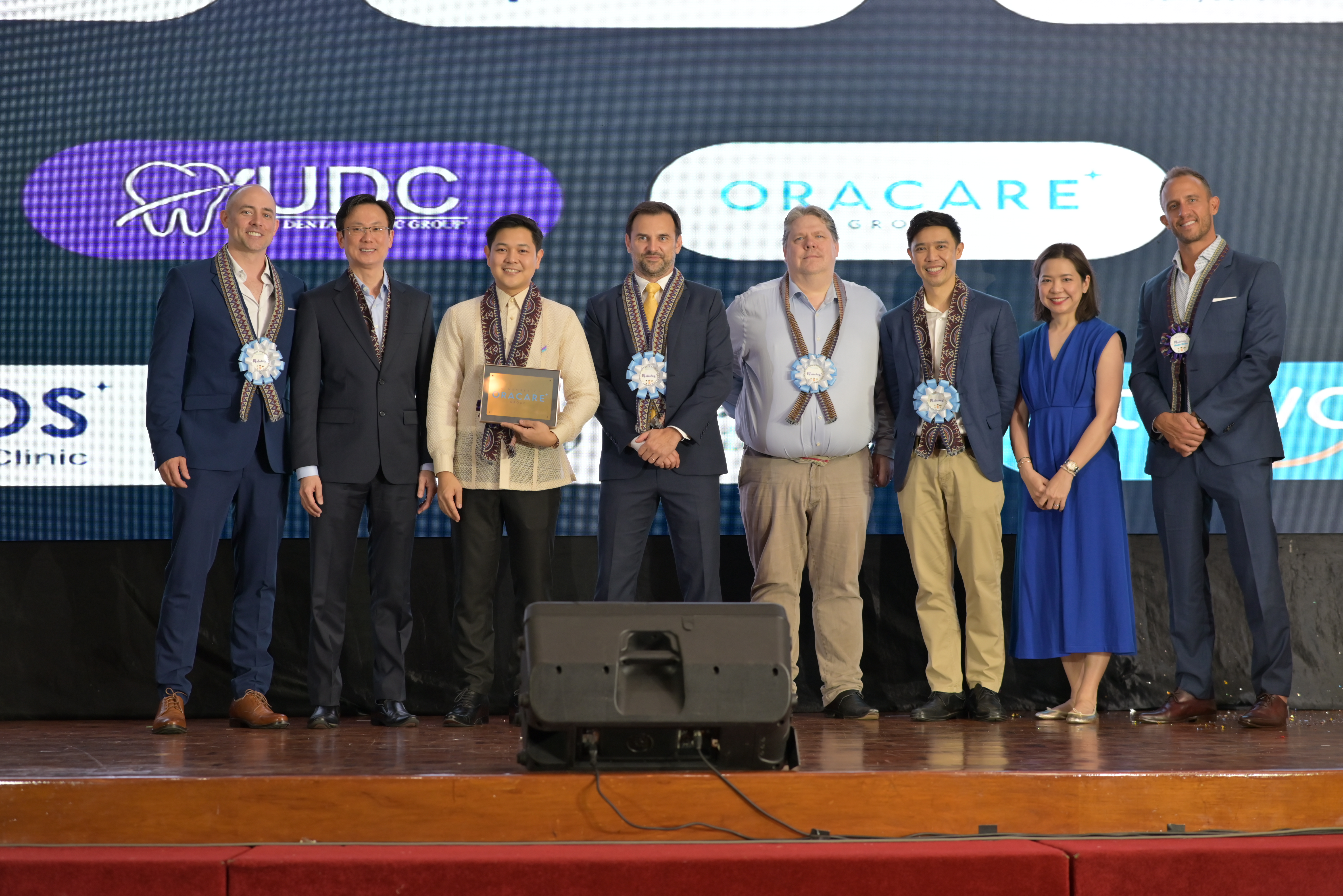 Leaders of the dental brands in the Oracare family at the Oracare-UDC celebration event on 27 October 2023 in Manila, the Philippines. <br>From left: Dr Matt Thompson, Co-founder and Clinical Director – Expat Dental; Leon Luai, Co-founder and CEO – Oracare Group; Dr Charlston Uy, Founder and CEO – UDC; Andy Cropp, Co-founder and Chief Financial Officer – Oracare Group; Nick Watkins, Non-Executive Chairman –  Oracare Group; Dr Adisorn Hanworawong, Founder and CEO – MOS Dental; Dr Paega Jarungidanan, Clinical Director – MOS Dental; Dr Shaun Thompson, Founder and Managing Director –  Expat Dental.<br>