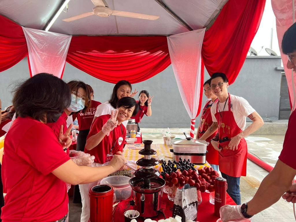 UM staff with the chocolate fountain desserts station