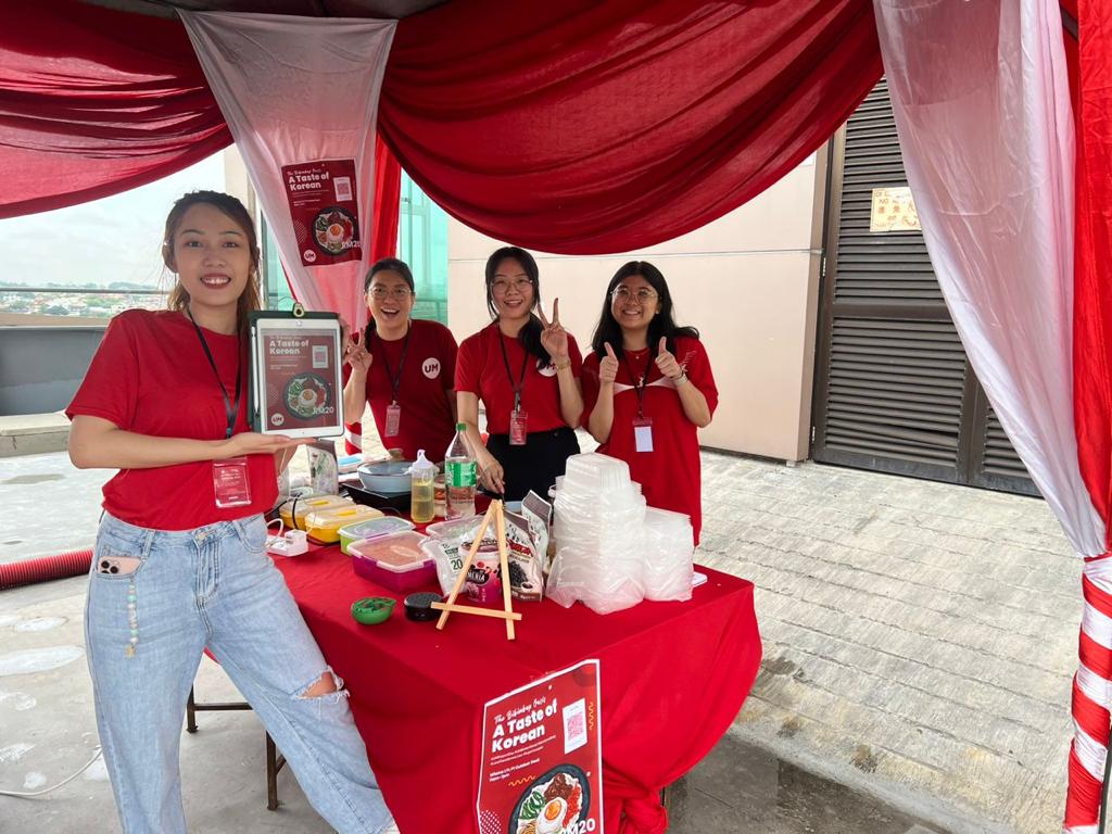 UM staff showing off their food fare.